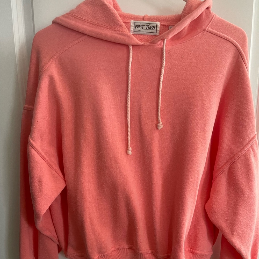 Pink pull over sweatshirt. Brand is Fast Turn, with hoodie and drawstring